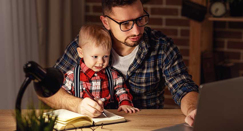 Father looking at computer