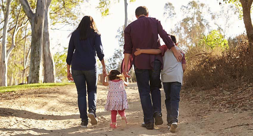 Family walking down a path