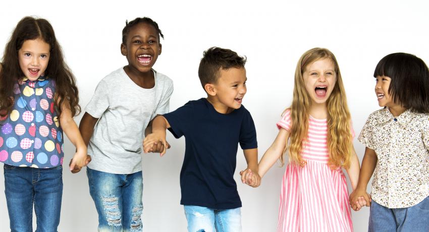 Group of young children holding hands